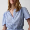 Kort peplum-top med knappar fram