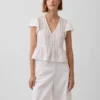 Kort topp med peplum i spetsvoile