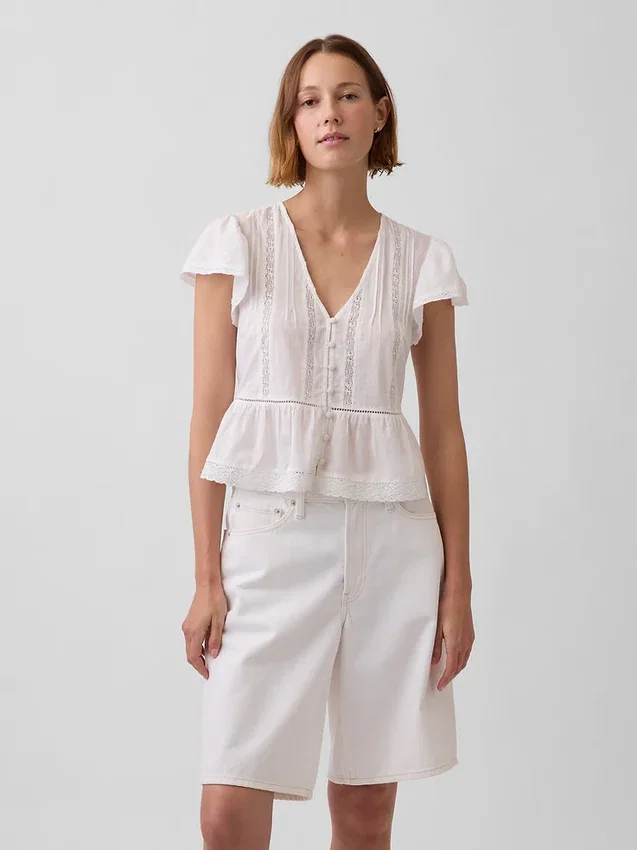 Kort topp med peplum i spetsvoile