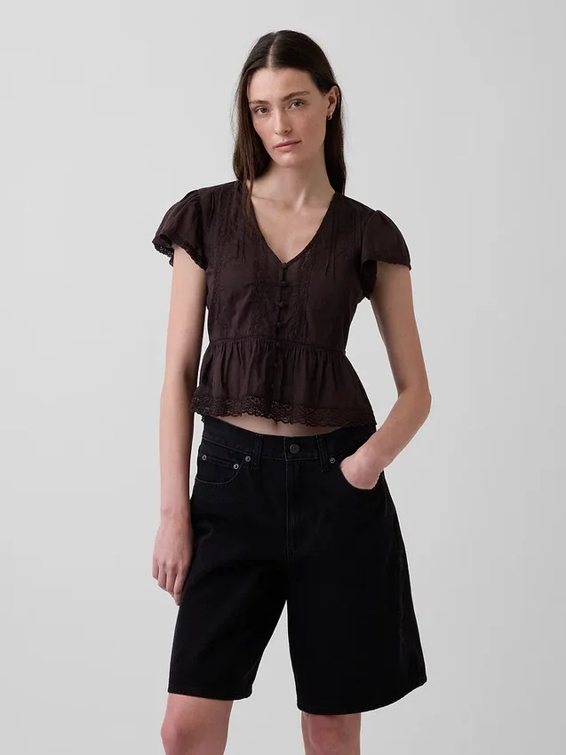 Kort topp med peplum i spetsvoile