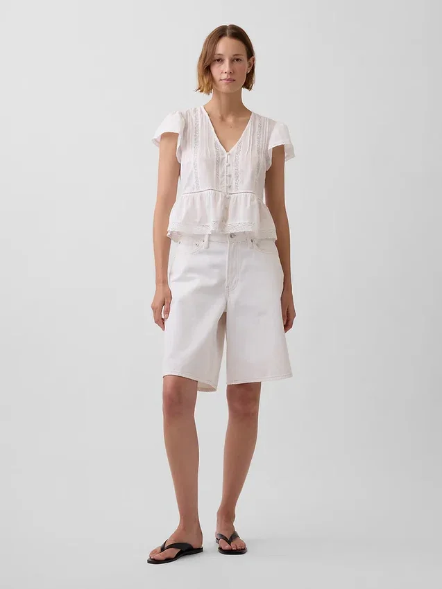 Kort topp med peplum i spetsvoile
