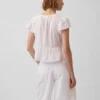 Kort topp med peplum i spetsvoile