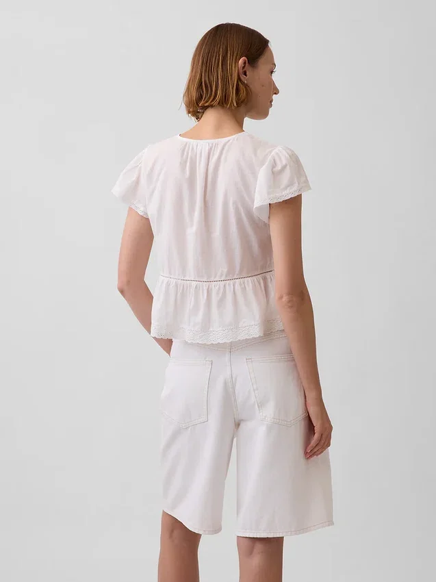 Kort topp med peplum i spetsvoile
