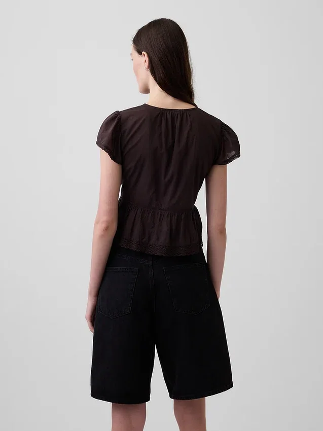 Kort topp med peplum i spetsvoile