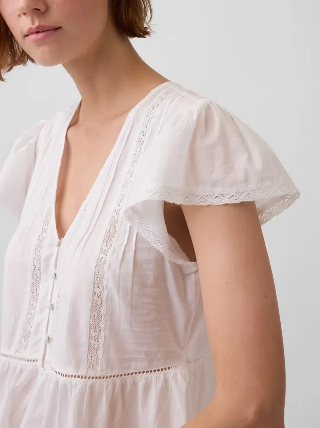Kort topp med peplum i spetsvoile