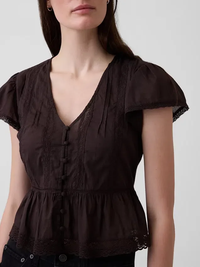 Kort topp med peplum i spetsvoile