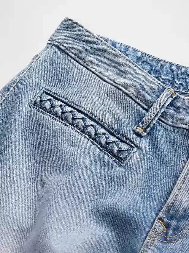 Lågmidjade, flätade fickor, långa och smala Jeans