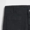 Lågmidjade långa och smala byxor i twill