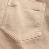 Lågmidjade långa och smala byxor i twill