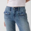 Lågmidjade, långa och smala Jeans med påsydda fickor