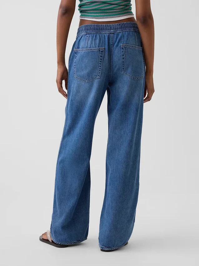 Lågmidjade, ultramjuka, lösa 90-talsjeans med delfinfåll