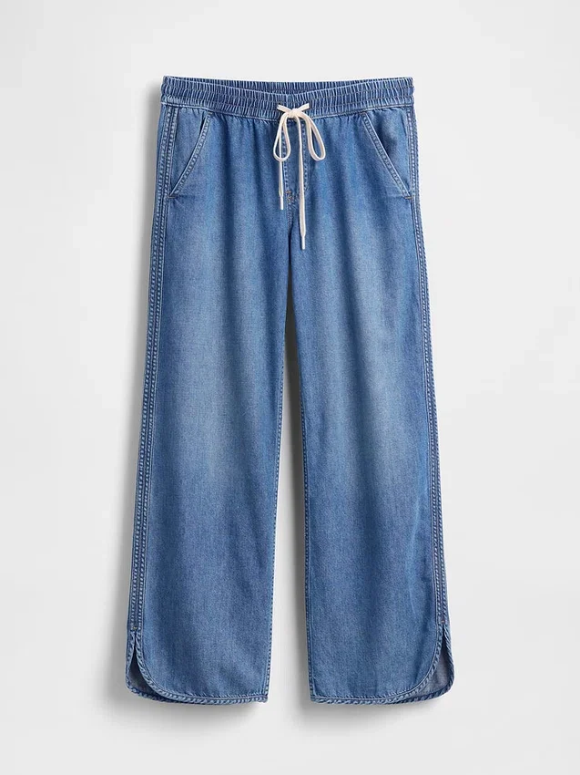 Lågmidjade, ultramjuka, lösa 90-talsjeans med delfinfåll