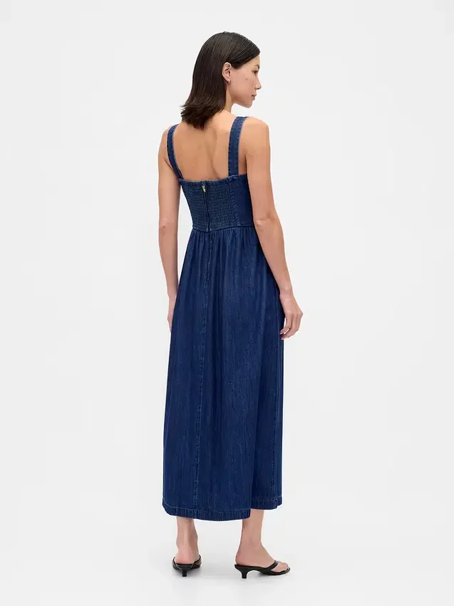 Midi-klänning i denim med korsett och nedsänkt midja