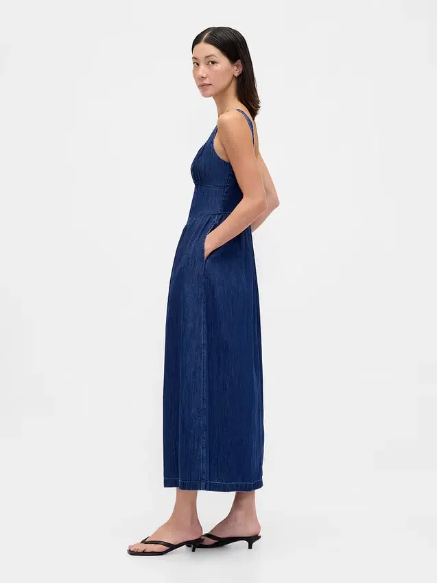 Midi-klänning i denim med korsett och nedsänkt midja