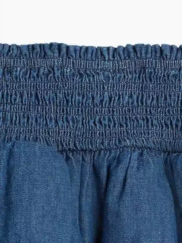 Mini-skort i smockad denim för barn