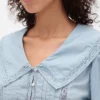 Peplum-top med krage och V-ringning