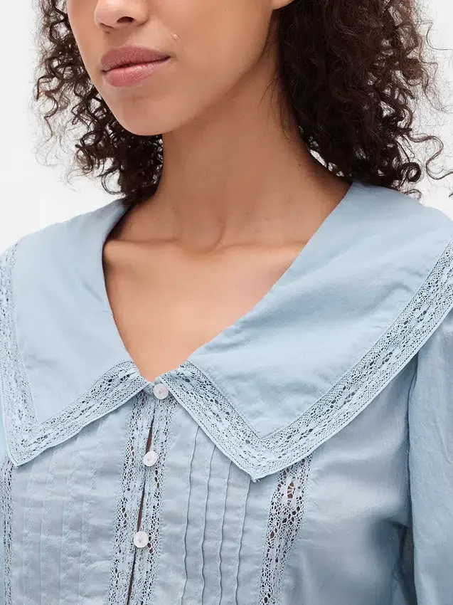 Peplum-top med krage och V-ringning