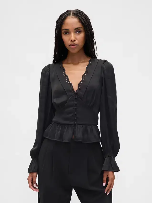 Peplum-top med V-ringning och hålbroderi