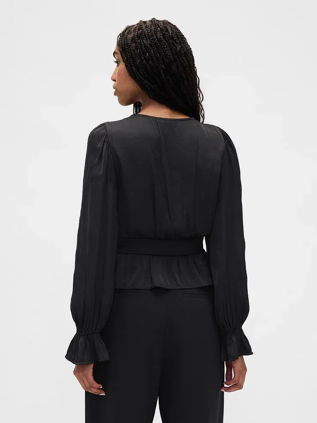 Peplum-top med V-ringning och hålbroderi