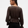 Peplum-top med V-ringning och hålbroderi