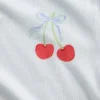 Pyjamas-set för barn i återvunnen ribbstickad tröja och shorts