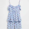 Pyjamas-set för barn i återvunnet material med volangtop och shorts