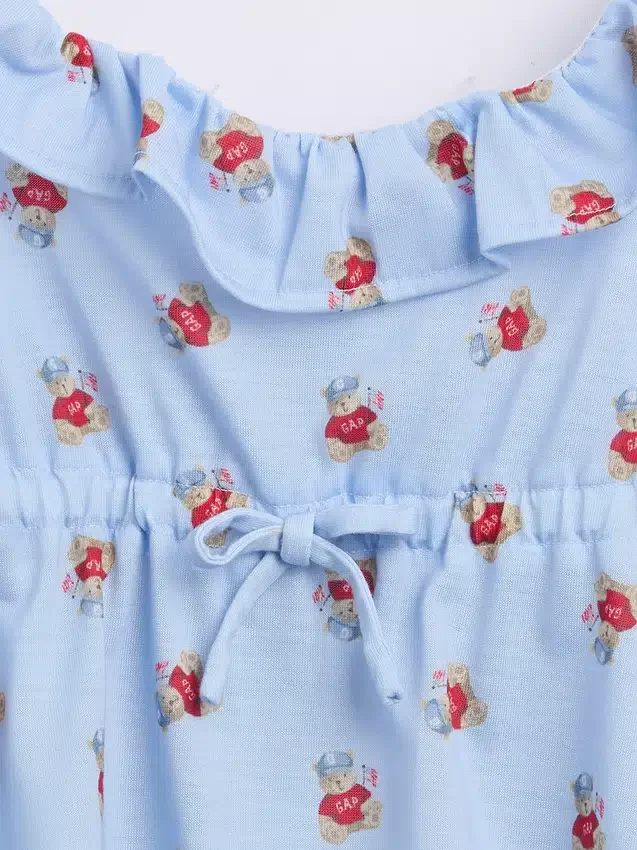 Pyjamas-set för barn i återvunnet material med volangtop och shorts