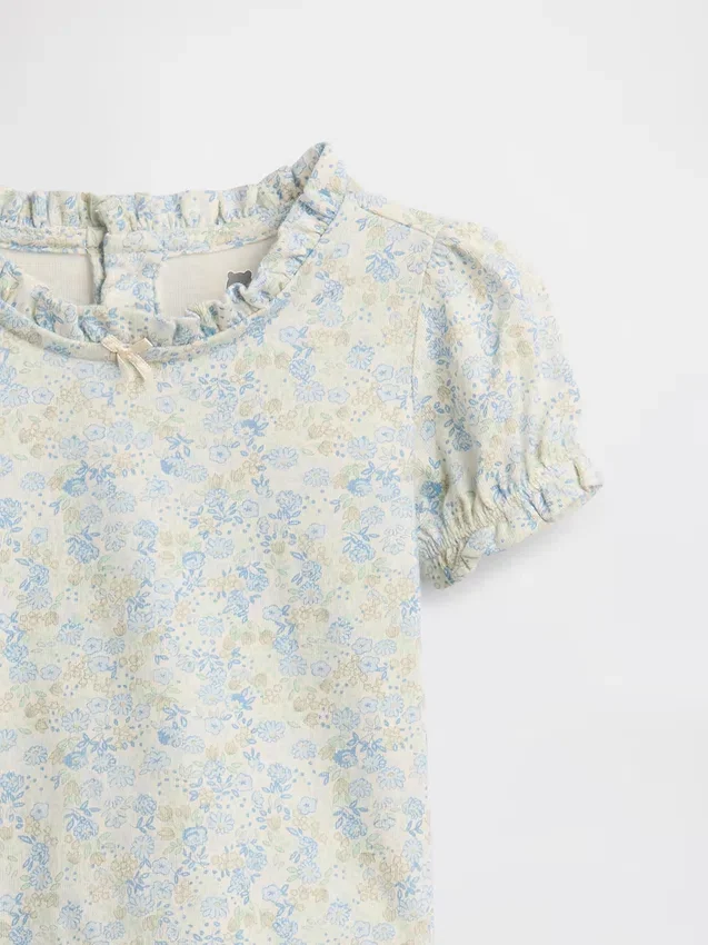 Set med blommönstrat plagg i ekologisk bomull för spädbarn