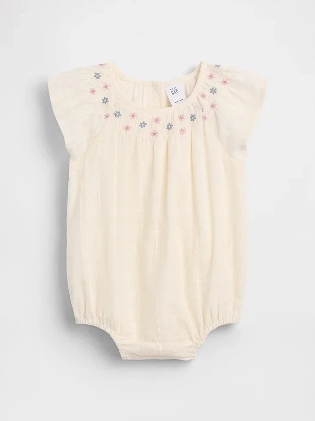 Smockad bodysuit med blommönster för spädbarn
