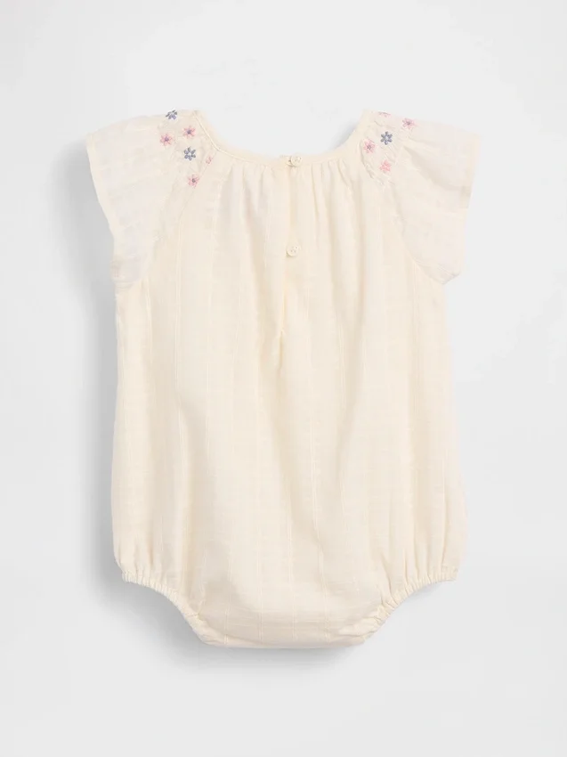 Smockad bodysuit med blommönster för spädbarn