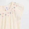 Smockad bodysuit med blommönster för spädbarn