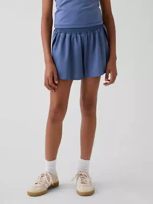 Snabbtorkande löparshorts med fjärilskant för barn