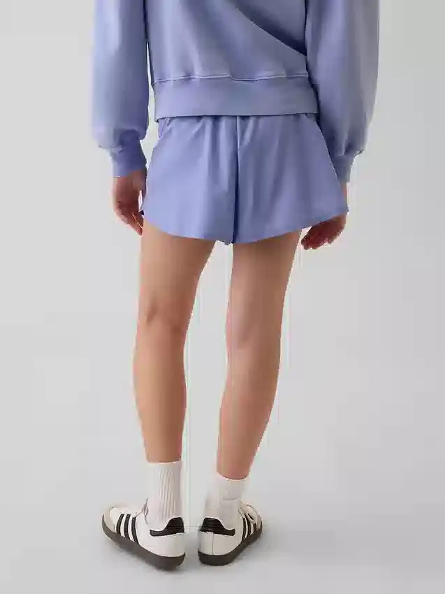 Snabbtorkande löparshorts med fjärilskant för barn