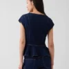 Tajt sittande peplum-top i denim med korta ärmar