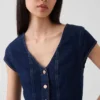 Tajt sittande peplum-top i denim med korta ärmar
