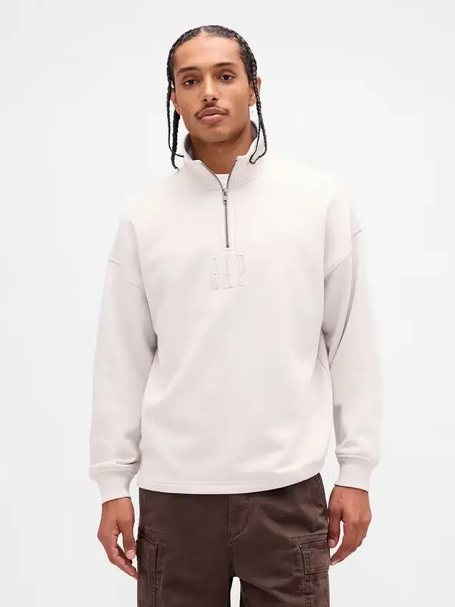 Tjock, oversized tröja med logo och kvartslås
