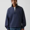 Tjock, oversized tröja med logo och kvartslås