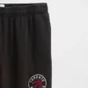 Tjocka joggingbyxor med NBA Toronto Raptors-logotyp