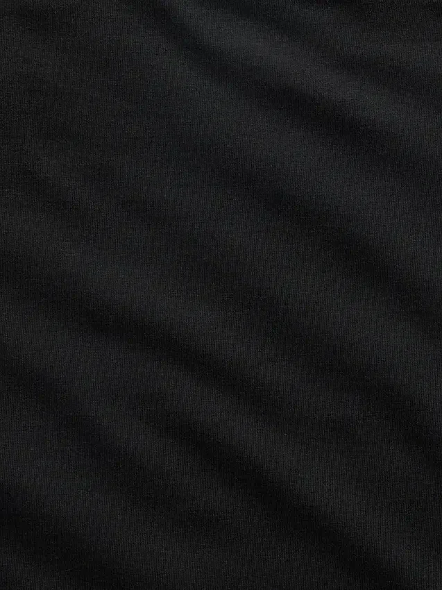 Tättstickad jersey-T-shirt med bar axel och kort passform