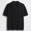 Överdimensionerad polotröja med kvartslås och fickor